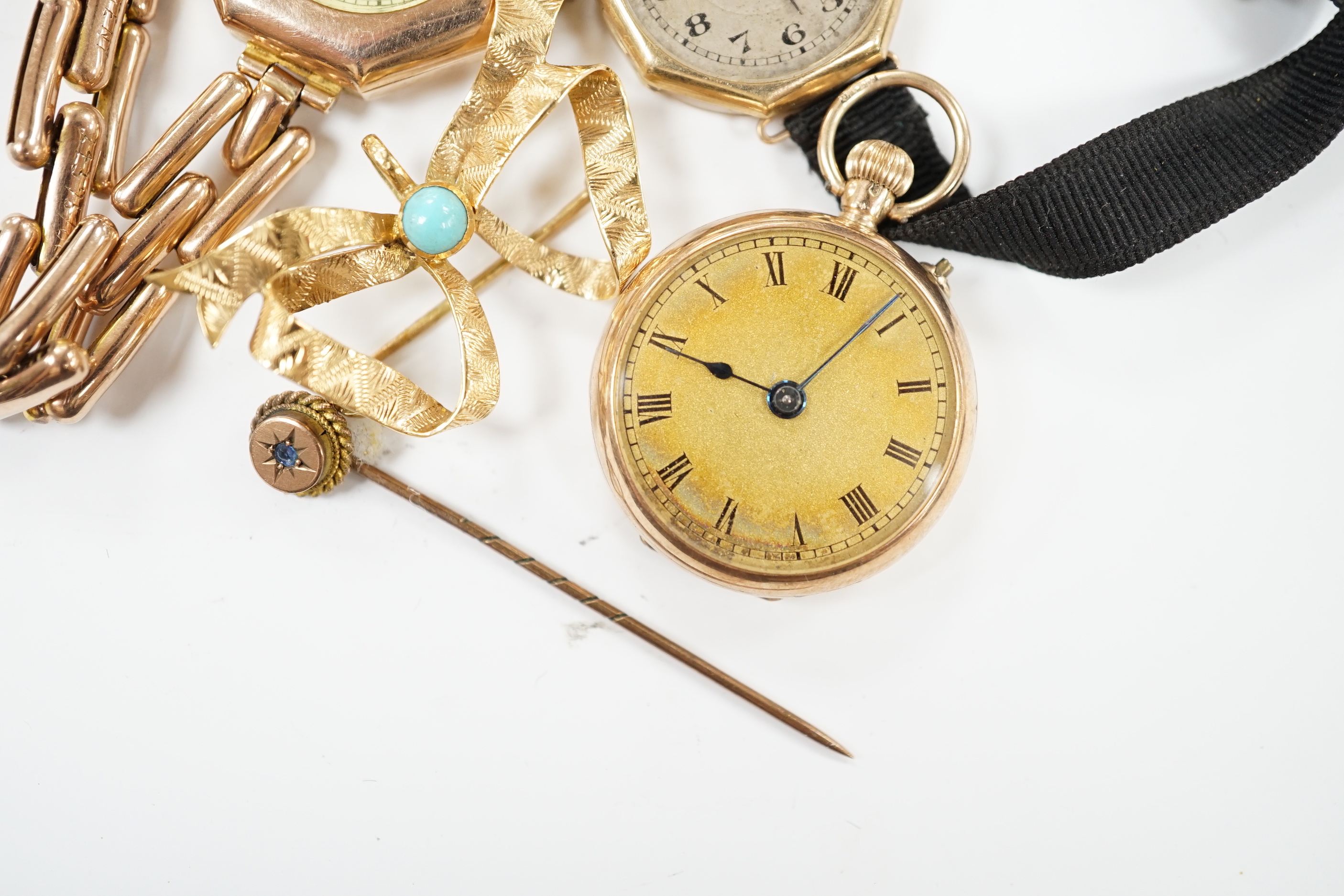 Two early 20th century 9ct gold manual wind wrist watches, one on an expanding 9ct bracelet, a 9ct gold fob watch, a 750 and turquoise set 'butterfly' shaped ribbon bow brooch and a stick pin.